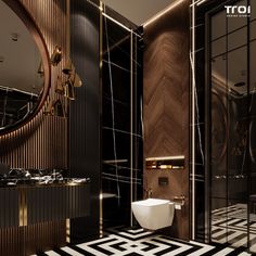 a bathroom with black and white tiles, gold accents and a round mirror on the wall