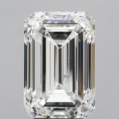 an emerald cut diamond on a gray background with the center stone in white and black