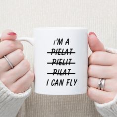 a woman holding a coffee mug with the words i'm a pleat, relief, and i can fly on it