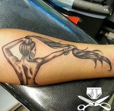 a woman's arm with a tattoo on it