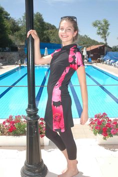 women's modest swimsuit ~ A beautiful and comfortable modest swimsuit, at an unbeatable price. We designed this suit to be flattering to every figure. This modest style is easy to swim in. Made from the finest quality chlorine safe swim fabric. Available in black with pink and red floral print insets. In women's sizes M - XXL. Swimming Ideas, Dressing Modestly, Modest Workout, Apostolic Clothing, Swimsuits 2017, Modest Outfit Ideas, Modest Apparel