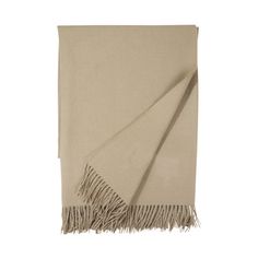 a beige blanket with fringes on it