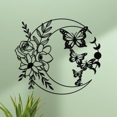 a metal wall hanging with flowers and butterflies on it