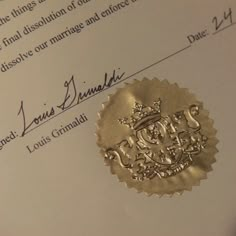 a close up of a document with a wax stamp on it and the word marriage written in cursive writing