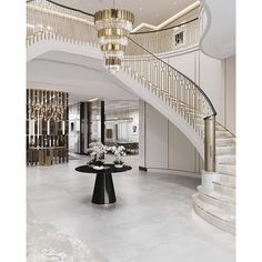 an elegant foyer with chandelier and marble floors