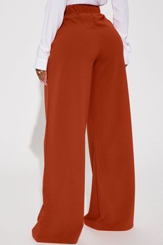 Available In Chocolate And Rust. Trouser Pant High Rise Button Detail Elastic Waist Back Front Pleats Wide Leg Stretch 95% Polyester 5% Spandex Imported | What Matters Most Wide Leg Trouser in Rust size Medium by Fashion Nova Pant Trousers Women Outfit, Wide Leg Pants Outfit Work, Trousers Women Outfit, Pants Outfit Work, Pant Trousers Women, Wide Leg Pants Outfit, Modest Dresses Fashion, Corporate Wear, What Matters Most