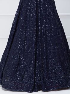 Introducing our amazing navy blue sequins georgette reception wear lehenga choli, the perfect ensemble for engagements, receptions, and parties. This stunning navy blue lehenga is crafted with georgette material and adorned with exquisite sequin and thread embroidery work, making it a truly eye-catching piece.
The lehenga comes in a rich navy blue color, which adds a touch of elegance and sophistication to your look. It is semi-stitched up to 42 inches, ensuring a comfortable and flattering fit Elegant Blue Lehenga With Sequins, Evening Blue Lehenga With Mirror Work, Formal Anarkali Lehenga With Sequins, Blue Georgette Lehenga For Evening, Evening Blue Georgette Lehenga, Blue Anarkali Set With Sequins For Reception, Blue Georgette Anarkali Set With Sequins, Blue Evening Lehenga, Glamorous Blue Lehenga For Evening