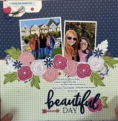 a hand holding up a scrapbook with two pictures on it and the words beautiful day