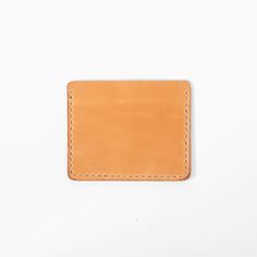 Details Made in America (in our Atlanta studio!) 4 inches by 3.25 inches One pocket and two card slots Traditional harness leather made by Wickett & Craig Can be monogrammed at no additional charge The Russet slim card wallet is one of the sleekest wallets in the KMM & Co. lineup. But don't let its modern silhouette fool you: This wallet is cut from an American-made harness leather, one of the most traditional leathers in our studio. This leather is processed with a hot-stuffing method t Minimalist Leather Bifold Card Holder, Minimalist Leather Rectangular Card Holder, Rectangular Leather Card Holder With Leather Patch, Leather Wallets For Men, Wallets For Men, Men's Wallets, Wallet For Women, Best Wallet, Leather Wallets