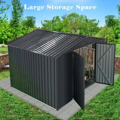 a large storage space in the middle of a grassy area with trees and bushes behind it