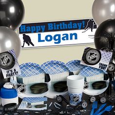 a hockey themed birthday party with black and silver balloons, streamers, cups, and decorations