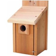 a wooden bird house with the door open