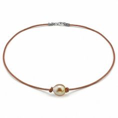 Sophisticated and stylish, this pearl necklace is an eye-catching addition to your casual looks. Expertly designed, this rustic style features a single 11.0mm baroque-shaped golden cultured South Sea pearl centered along a leather cord. Buffed to a brilliant luster, this 17.0-inch necklace secures with a sterling silver lobster claw clasp. Pearl Leather Necklace, Leather Pearl Necklace, Pearl Leather, White Necklace, South Seas, South Sea Pearls, Jewelry Making Tutorials, Sea Pearls, Pearl Types