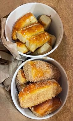 two bowls filled with different types of pastries