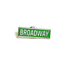 a green and white street sign that says broadway