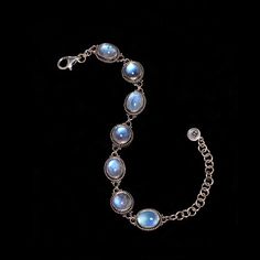 Sterling Silver Rainbow Moonstone bracelet, delicately designed & enhanced with opulent Moonstones, giving a sensual, feminine aura to this Elizabethan-inspired piece. Available in sizes 7 and 8. * Handcrafted in the finest .925 Sterling Silver. * Available in size 7:  6.5"-8" & size 8: 7"-9" * From my Mystic Moon Collection, featuring high-quality Rainbow Moonstones from India, fully-charged to enhance your intuition, provide protection & attract love. * Each natural gemstone is unique and may Elegant Oval Jewelry With Moon Phase, Elegant Oval Moon Phase Jewelry, Luxury Natural Stones Bracelets, Mystical Gemstone Jewelry For Formal Occasions, Elegant Cabochon Bracelet Jewelry, Elegant Moon Phase Bracelet, Luxury Moon Shaped Jewelry For Formal Occasions, Luxury Silver Bracelets With Cabochon, Elegant Moon Phase Bracelet As A Gift