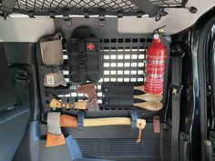 the inside of a van with tools and other items