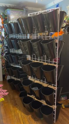 the shelves are filled with many different types of buckets