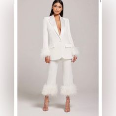 For The Chic Bride-To-Be, This Highly Sophisticated White Blazer With Feather Cuff Details Is Crafted From Our Exclusive Crepe And Satin Mix. With Feather Detailing And Contrast Satin Details, This Blazer Will Really Make An Entrance. Why Not Pair With Our Matching Margot Pants And Nicole Top To Complete The Look? - Made From Crepe Fabric - Fully Lined With Satin - Feather Trim Detailing To Cuffs - A Structured Blazer With Internal Shoulder Pads - Single Breasted With A Satin Button To The Front - Contrast Satin Lapel & Functional Pockets Nadine Merabi Bridal, White Suit Wedding Women, Two Piece Blazer Set, Wedding Suit Women, Nadine Merabi, Feather Cuff, Structured Blazer, Chic Brides, White Suit