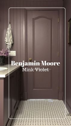 the front door to a bathroom with purple walls and tile flooring, along with a white framed sign that reads benjamin moore mink violett