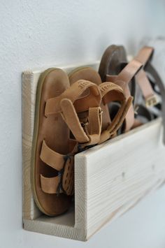 there are many pairs of shoes in the shoe rack