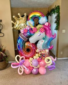 a large number balloon sculpture in the shape of a unicorn with balloons on it's back