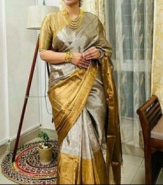 Step into the realm of timeless elegance with our Golden Grayish Silk Saree, meticulously handwoven in pure silk Chanderi. Each thread tells a tale of artisanal dedication, as skilled hands craft this masterpiece over months, ensuring every detail exudes unparalleled beauty. Paired with a plain unstitched raw silk blouse, available in a spectrum of colors to complement your style. Elevate your ensemble with the option of custom blouse stitching, adding a bespoke touch to your impeccable attire. 🌟 Don't just wear a saree; own the spotlight with Poonam Sarees! 💫🛍️ Fabric: Pure Silk Colour: Same as picture Work: Handwoven Chanderi Wash Care: Dry Clean NOTE: Expect minor variations due to lighting or monitor settings. Our products are handmade, and we do not offer return, refund, cancellati Deepika Padukone Sari, Golden Colour Saree, Hands Craft, Raw Silk Blouse, Kora Silk Sarees, Blouse Stitching, Chanderi Silk Saree, Saree Trends, Saree Look