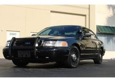 a police car parked in front of a building