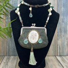 Bh Original Design Necklace Assembled Using A Vintage Leather Count Purse Adorned With A Vintage Abalone And Mother Of Pearl Shell, Green Quartz Briolette Beads, Cotton Tassel, And Hung From Mother Of Pearl, Jade, Green Quartz, And Vintage Aurora Borealis Crystal Beads. Measures 26” Long Assemblage Jewelry And Wearable Textiles Are Made Using Pre-Loved Pieces Of Jewelry, Toys, Artifacts, Vintage Fabrics, And Anything Of Interest! They Also Might Show Signs Of Wear. They May Be Discolored, Missha Treasure Necklace, Xo Necklace, Letter Necklace Silver, Wooden Bead Necklaces, Crystal Jewelry Sets, Aurora Borealis Crystal, Assemblage Jewelry, Tree Of Life Necklace, Glass Pendant Necklace