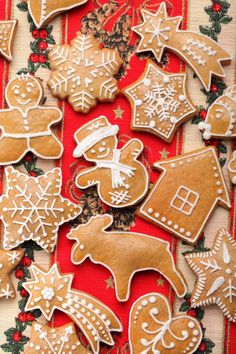 gingerbread cookies are arranged on a red and white background