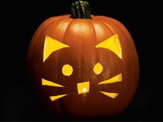 a pumpkin with a cat's face carved into it