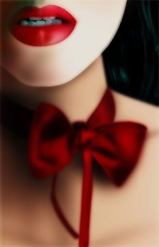 a woman wearing a red bow tie and green eyes