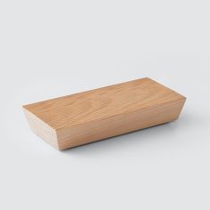 a wooden object on a white background