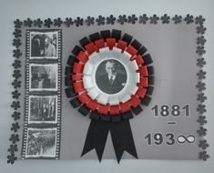 an award plaque with pictures and ribbons around it