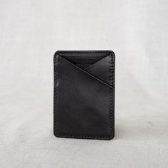 This Money Clip Wallet is perfect for the guy who loves to carry cash and a few cards. It's modern and sleek, and designed to hold the basics. Made with durable, full-grain leather, he'll love this purchase for years to come. Modern Rfid Blocking Wallets, Minimalist Black Everyday Wallet, Minimalist Wallets With Card Slots For Travel, Minimalist Travel Wallets With Card Slots, Minimalist Travel Wallet With Card Slots, Everyday Rectangular Wallet With Rfid Blocking, Casual Leather Card Holder With Card Slots, Modern Card Holder With Interior Slots For Everyday Carry, Modern Leather Card Holder With Phone Sleeve