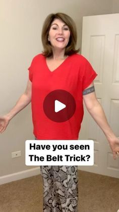 a woman standing in front of a door with her hands out and the words have you seen the belt trick?