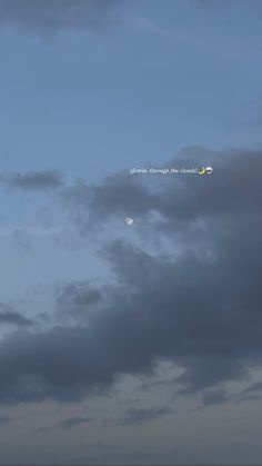 an airplane is flying in the sky at night with moon and clouds behind it,