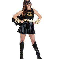 a woman in a batgirl costume is posing for the camera with her hands on her hips