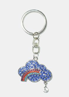 a keychain with a rainbow and cloud on the front, hanging from a metal hook