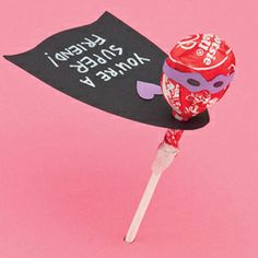 a candy lollipop with a sign on it