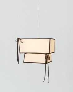 a rectangular light fixture hanging from a ceiling