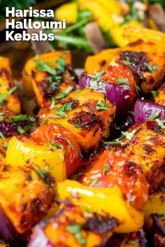 grilled vegetables on skewers with herbs and kebabs text reads harissa halloumi kebabs