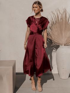 Discover elegance and luxury with Theia Satin Short Sleeve Midi Dress in Burgundy. This sophisticated dress features a midi length with short sleeves, perfect for any formal or party occasion. Made with high-quality satin, it exudes a tasteful and exclusive feel. Elevate your style with the artful design and rich burgundy color of this dress. Size Guide: Model is 5’7” tall, and has a 33.4” bust, 26.5” waist, & 34.6” hips. She is wearing a S / US 4 / AU 8. This dress is true to size. Material: 100% Polyester. Feature: Crew neckline. Short Sleeves. Waist Tie. Midi Length. Satin Fabrication. Full lined. Back invisible zipper closure. Care Instructions: Machine wash / Cold hand wash Satin Short Sleeve, Burgundy Midi Dress, Short Sleeve Midi Dress, Reindeer Headband, Rich Burgundy, Satin Short, Sophisticated Dress, Midi Short Sleeve Dress, Sleeve Midi Dress