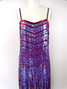 "This is a STUNNING vintage midi gown by Neil Bieff and Neiman Marcus. It's completely hand sewn, fully embellished with glass beading and sequins and is in perfect condition! Measurements: Bust - 34\" Waist - 32\" Hips - 38\" Length - 43\" Tag Size - Small This dress comes from a pet-free and smoke-free home. If you would like more info or have any questions, please don't hesitate to ask!" Red Beaded Dress, Midi Gown, Midi Gowns, Iridescent Dress, Checkered Jacket, Sequin Jacket, Bright Purple, Embellished Dress, Beaded Dress