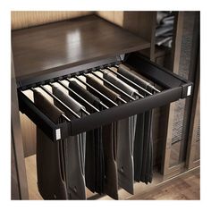 an open drawer in a cabinet filled with files