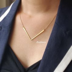 Super dainty Geometric Chevron necklace in gold.\ Material - Gold plated over brass, Stone\ Chain Length - 14 ~ 20 inches adjustable (Please chooe it from option)\ Pendant Measure - H 40mm x W. 57mm\ The jewelry comes in a gift box** Please check the shop policy for shipping information and jewelry carehttps://www.etsy.com/shop/Brillants/policy?ref=shopinfo_policies_leftnav Gold Necklaces With Delicate Chain For Bridesmaid Gift, Gold Necklace With Adjustable Chain For Bridesmaid Gift, Gold Clavicle Chain Jewelry For Bridesmaid Gift, Gold Charm Necklace With Simple Design For Gift, Chevron Jewelry, V Necklace, Hexagon Necklace, Gold Arrow, Chevron Necklace