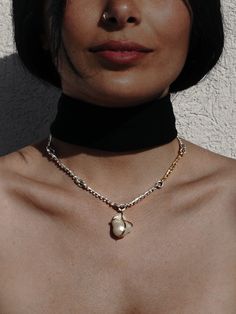 B A R O Q U E ∙ P E A R L ∙ C H O K E R ∙ N E C K L A C E This beautiful gold and silver choker features a baroque pearl that is reversible and has 18k Gold accents. The choker is adjustable from 16 to 20 inches to fit perfectly to your needs, and is sure to turn heads wherever you go. * Material: High Quality Solid 925 Sterling Silver- Hypo-Allergenic and Nickel Free * Finish: Sterling Silver | 18K Gold Accents. * Featuring a natural baroque pearl, irregular and beautiful just as nature intende Silver Fusion Jewelry With Pearl Pendant, Gold Necklaces With Sterling Silver Clasp, Gold Colored Sterling Silver Fusion Necklaces, White Sterling Silver Jewelry With Detachable Pendant, Diy Jewelry Necklace, Necklace Design, Silver Choker, Wedding Jewellery Necklace, Jewelry Boxes