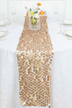 Our Matte Champagne Sequin Table Runner is not only a beautiful decorative accessory but also a versatile and stylish addition to your table decor. It can be used for various purposes, including bridal tables, guests tables, banquet tables, head tables, cake tables, present tables, and dessert tables. Its neutral champagne color complements any theme or color scheme, making it a versatile choice for any event. Cake Tables, Head Tables, Bridal Table, Dessert Tables