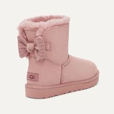 Brand New Ugg Mini Bailey Ribbed Bow Boots Size: 9 Color: Pink Details If Balletcore Were A Boot, It Would Be The Bailey Bow. This One Is Mini And Features A Knit Bow For All You Sugarplums. Suede Upper Fixed Bow, Knit 17mm Uggplush 60% Upcycled Wool, 40% Tencel Lyocell Lining 17mm Uggplush 60% Upcycled Wool, 40% Tencel Lyocell Sockliner Sugarcane Eva Outsole Recycled Polyester Binding 6" Shaft Height Woven Heel Label With Ugg Logo Rn 88276 Item No. 1157990/51 Dollette Shoes, Light Pink Uggs, Pink Uggs With Bows, Cozy Slippers Boots, Cute Uggs, Ugg Mini Bailey, Ugg Classic Mini Ii, Uggs With Bows, Knit Bow