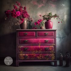 a dresser with flowers and vases sitting on it's top, in front of a wall